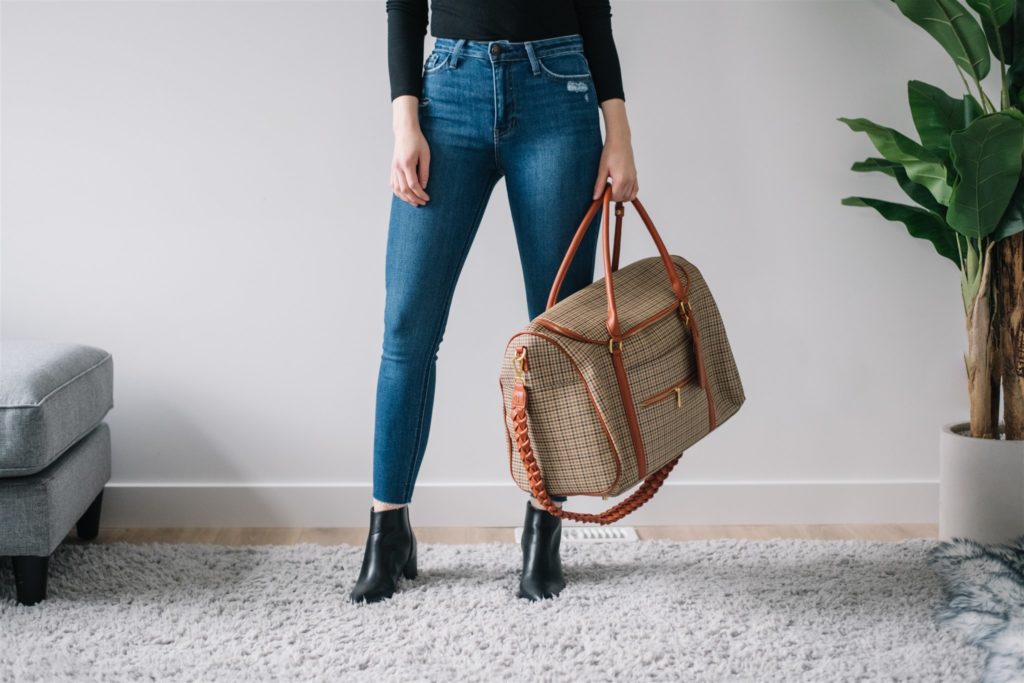 A woman holds a leather bag purchased at a local Edmonton boutique