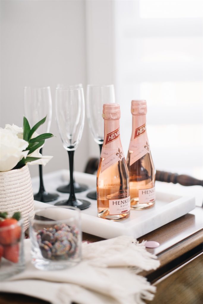 Two bottles of Henkell rose prosecco on a marble tray