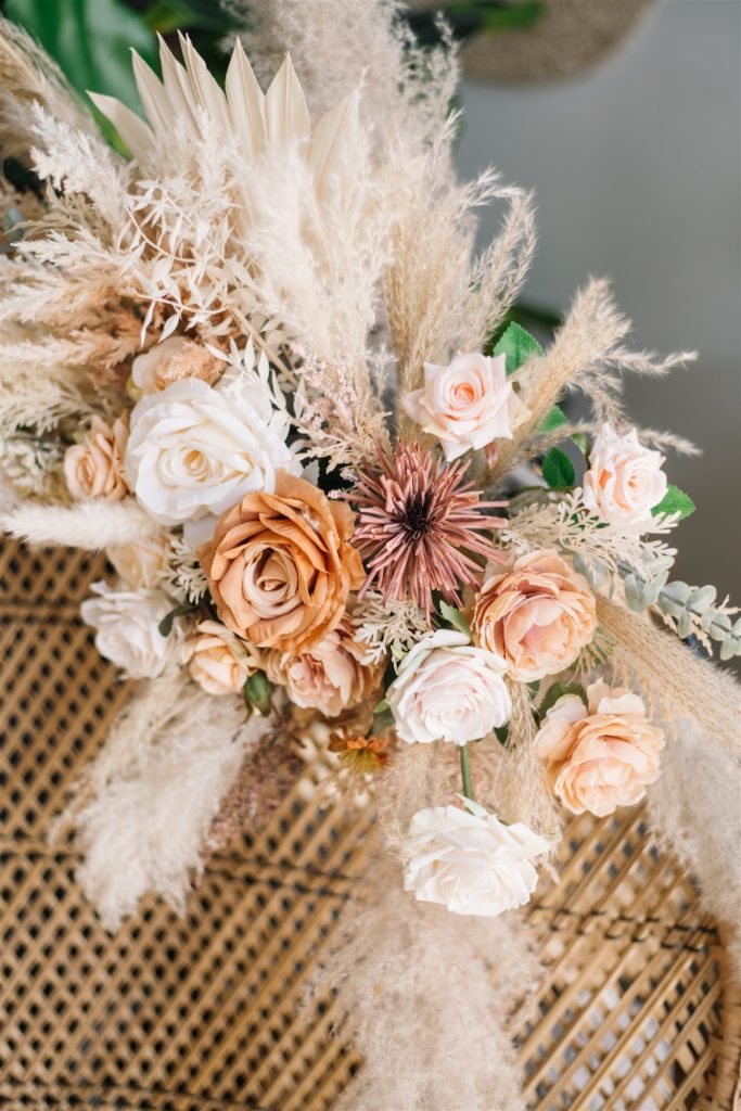 bouquet of pampas grass and warm neutral coloured flowers