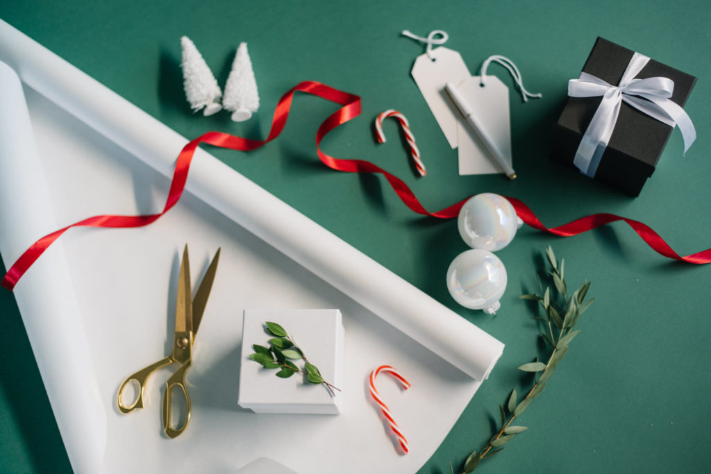 Green backdrop with red ribbon creates holiday content